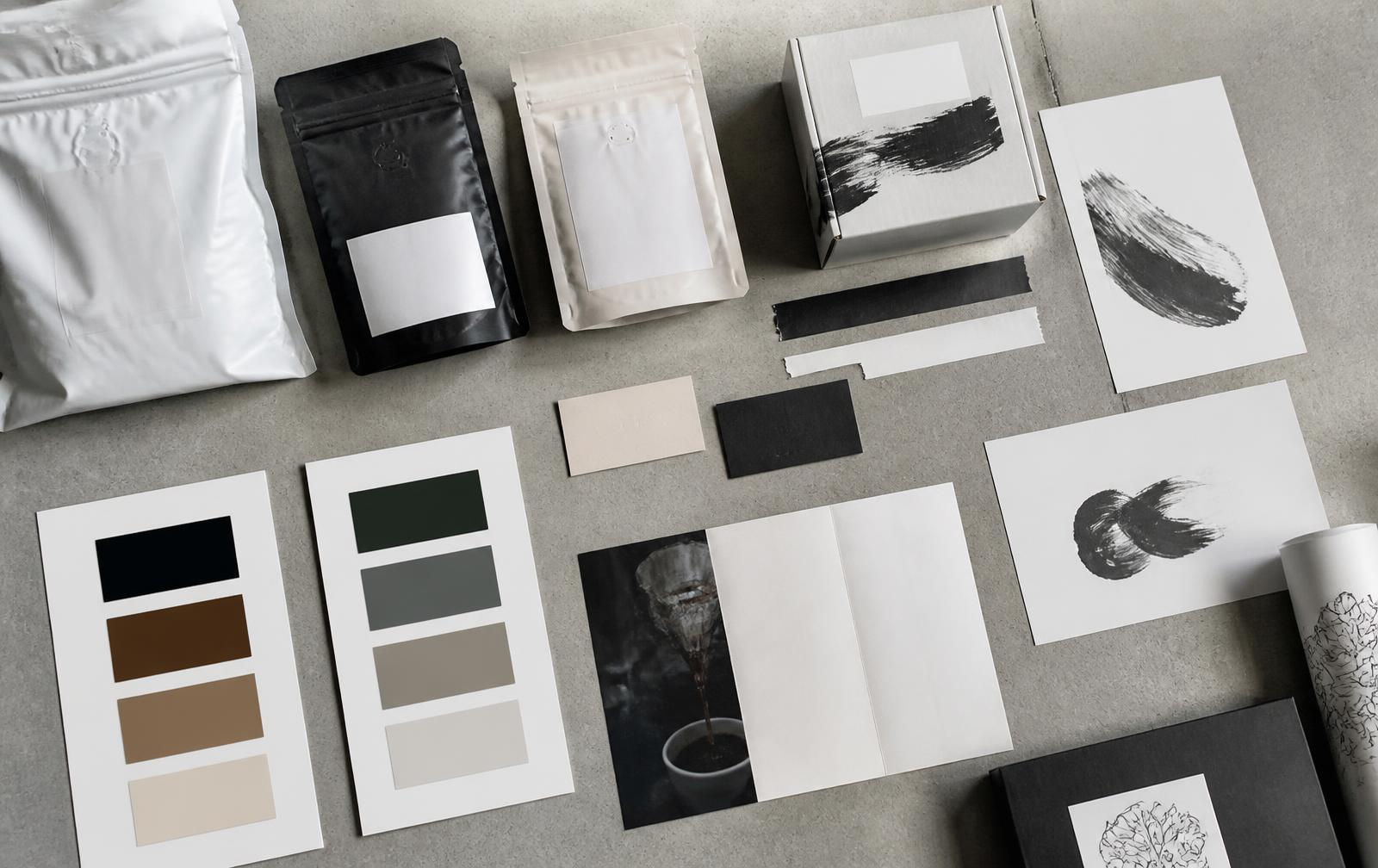 Brand identity kit for a D2C coffee label laid flat with packaging and colour swatches
